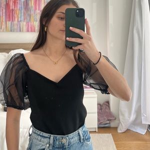 Black express new with tags never worn black puff mesh sleeves. Fitted top